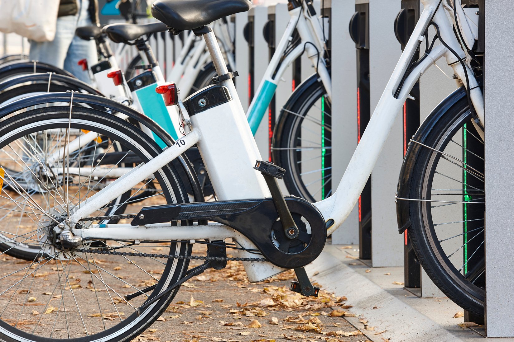 Urban electric bikes charging batteries in the city. Transportation